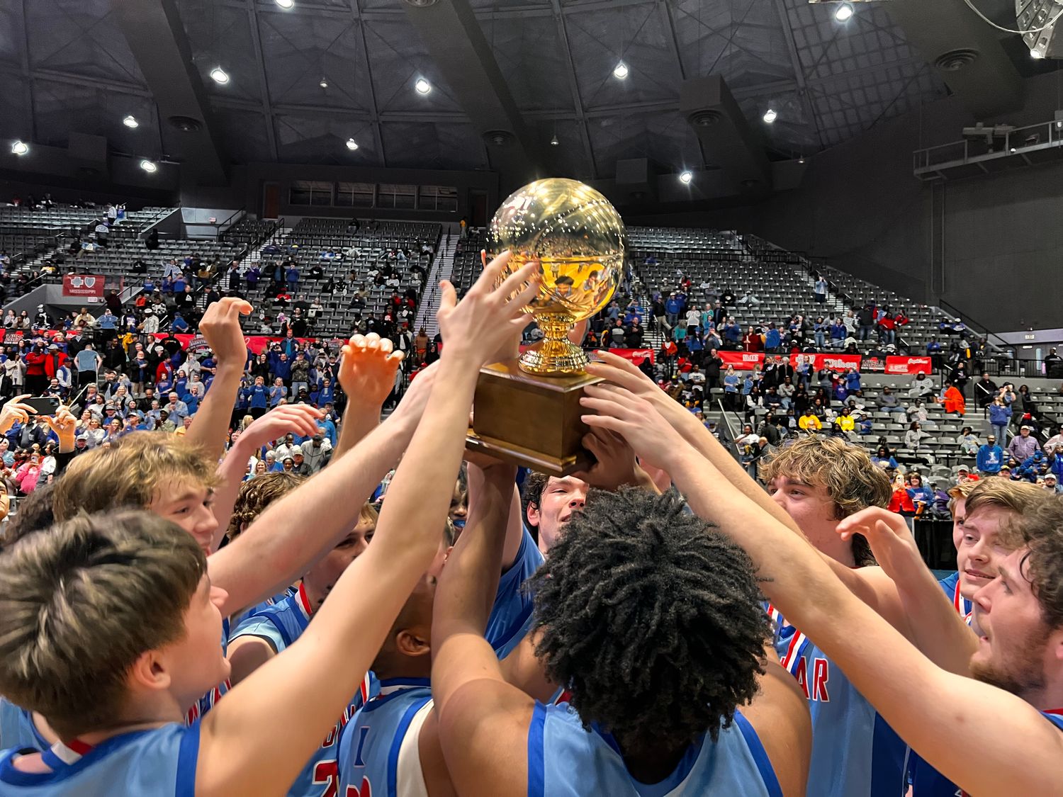 The Ingomar Falcons hoist the MHSAA Class 2A State Championship Trophy after defeating Bogue Chitto on Friday, March 1, 2024 at the Mississippi Coliseum in Jackson, Miss.